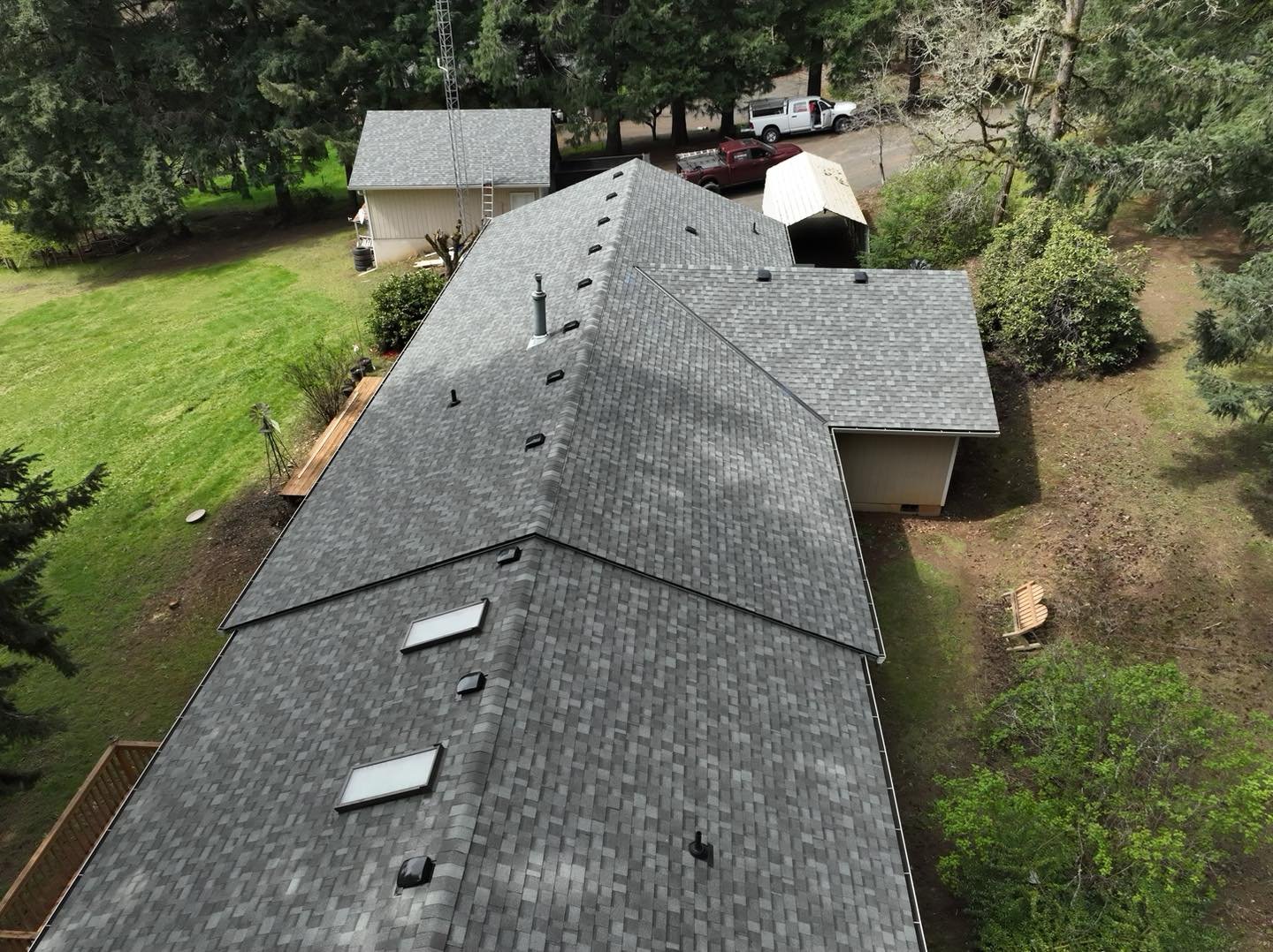 Aerial view of a completed architectural shingle roof installed by VC Contractor in Longview, WA