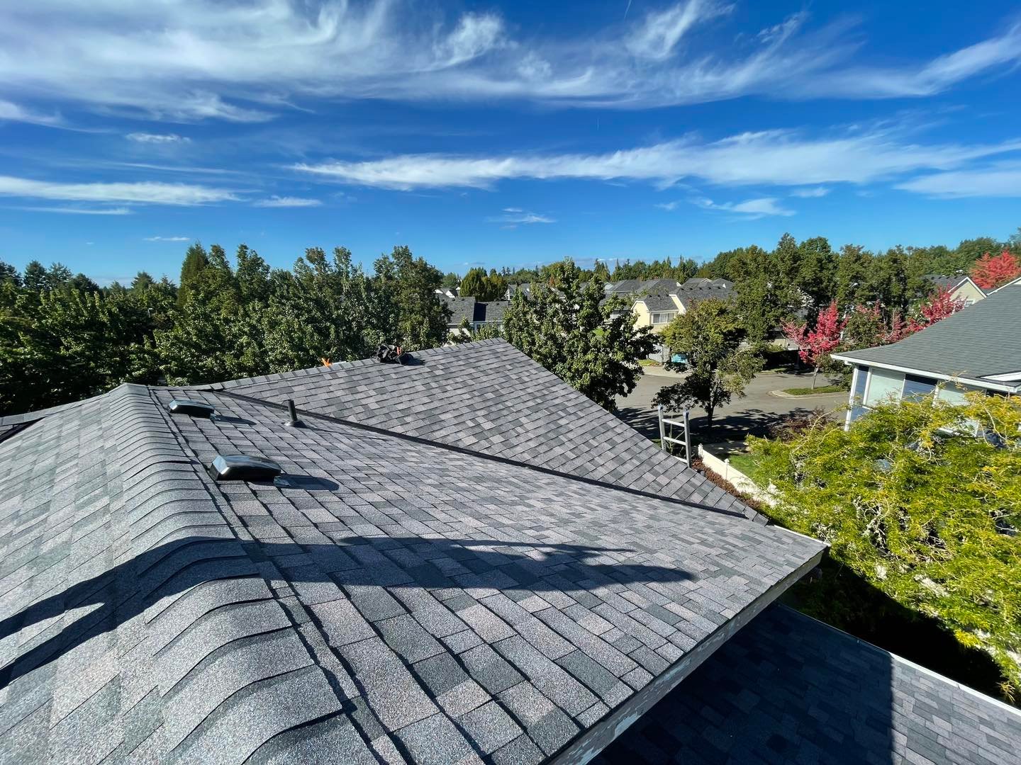 Completed dark architectural asphalt shingle roof and valley work in Longview, WA