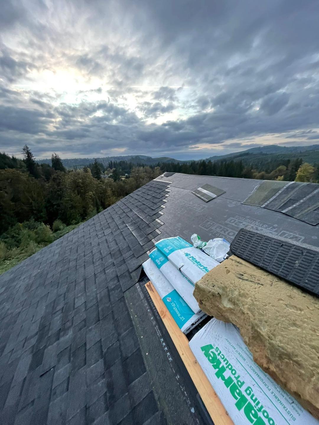Architectural shingle installation on a hilltop home with Cascade mountain views in Southwest Washington